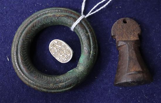 A Tibetan bronze seal, antique copper torq and an Egyptian scarab